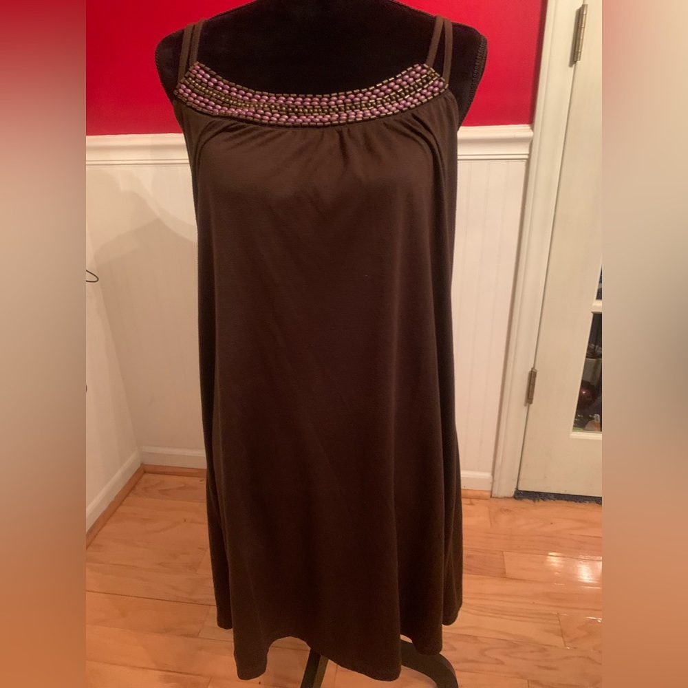 Brown sundress with adjustable back criss cross straps.Size L